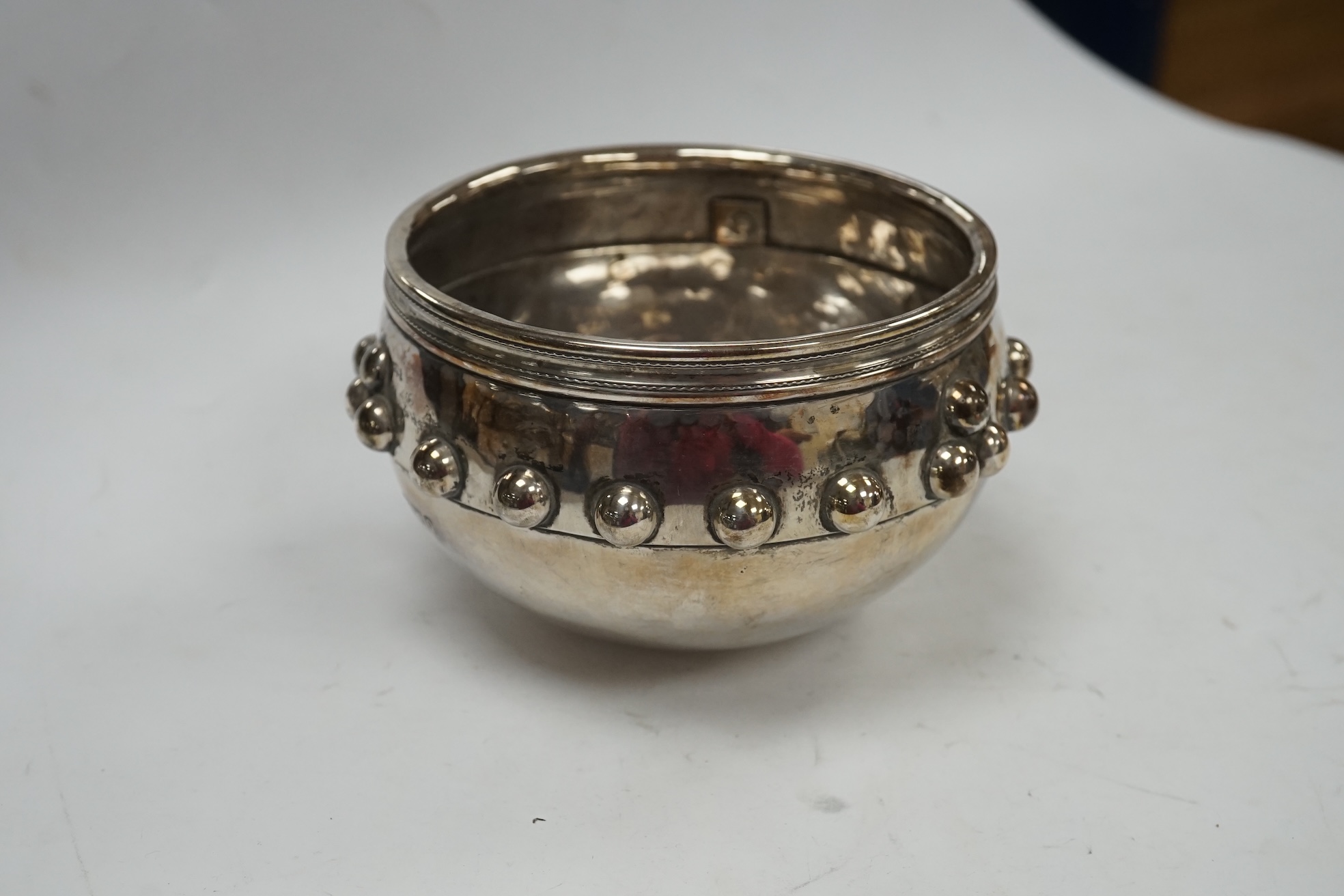 A late Victorian Arts and Crafts silver bowl, with studded band, maker SS, Chester, 1899, diameter 11.2cm, 8.4oz. Condition - fair to good